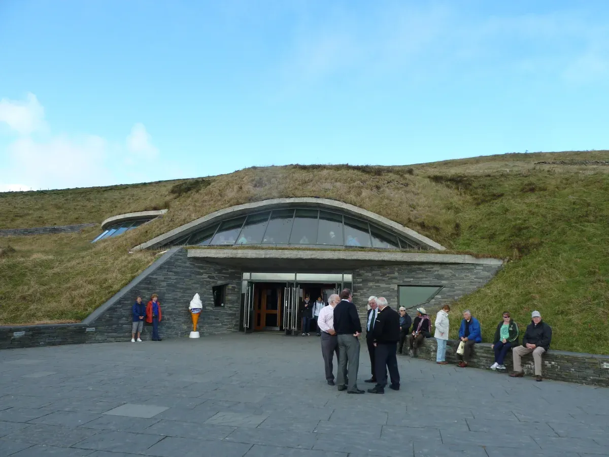 The Cliffs of Moher visitor centre built into the hillside, where day trips from Dublin to Cliffs of Moher stop, Ireland